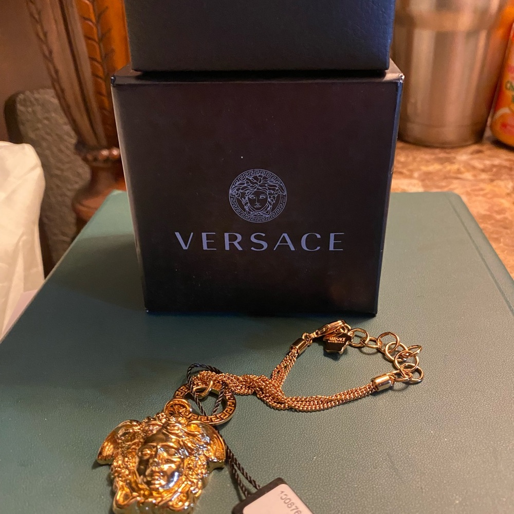 Versace Gold Medusa Pendant adjustable gold bracelet. New in box.